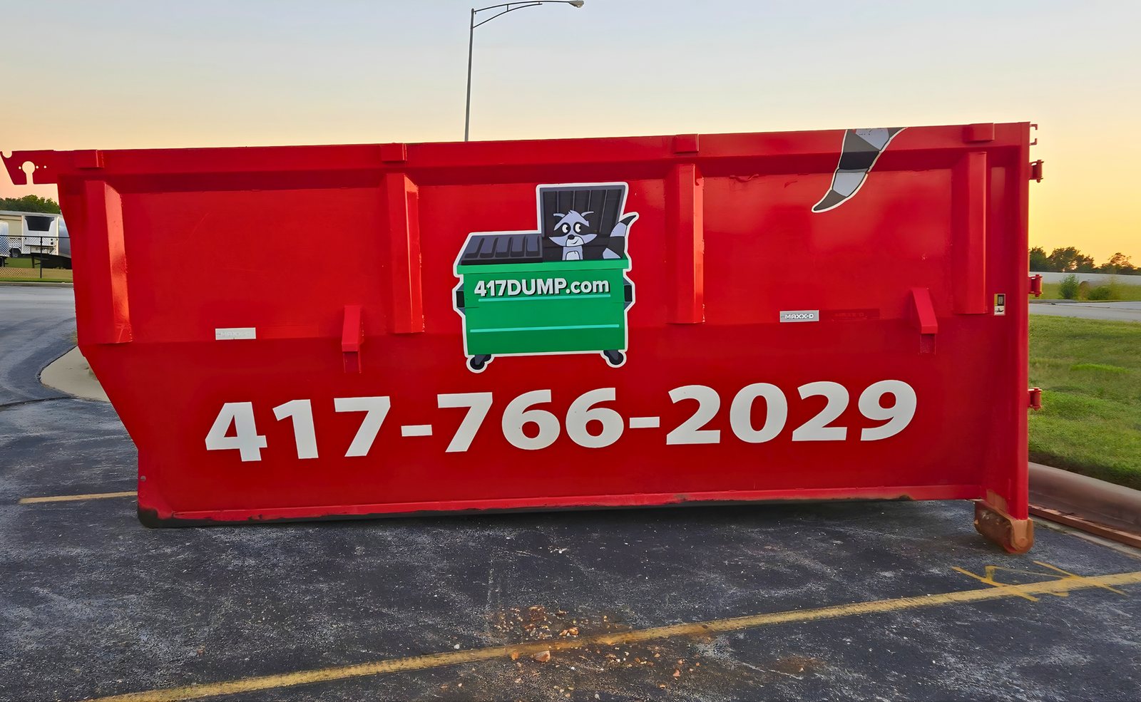 A 417 Dumpster Rental roll-off dumpster on a job in Marshfield, Webster County, MO.